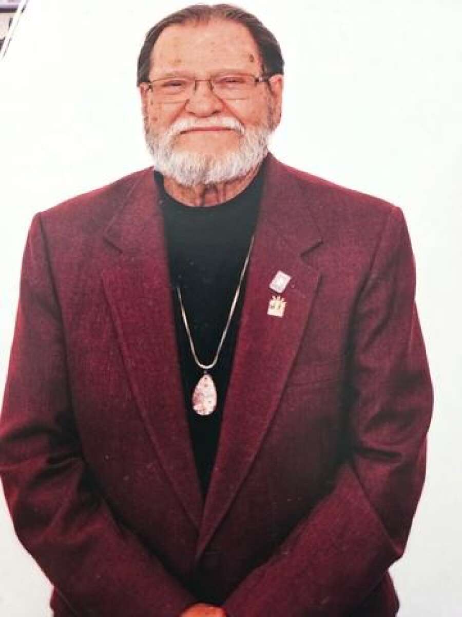 David K. Merrill Sr., smiling in a maroon jacket