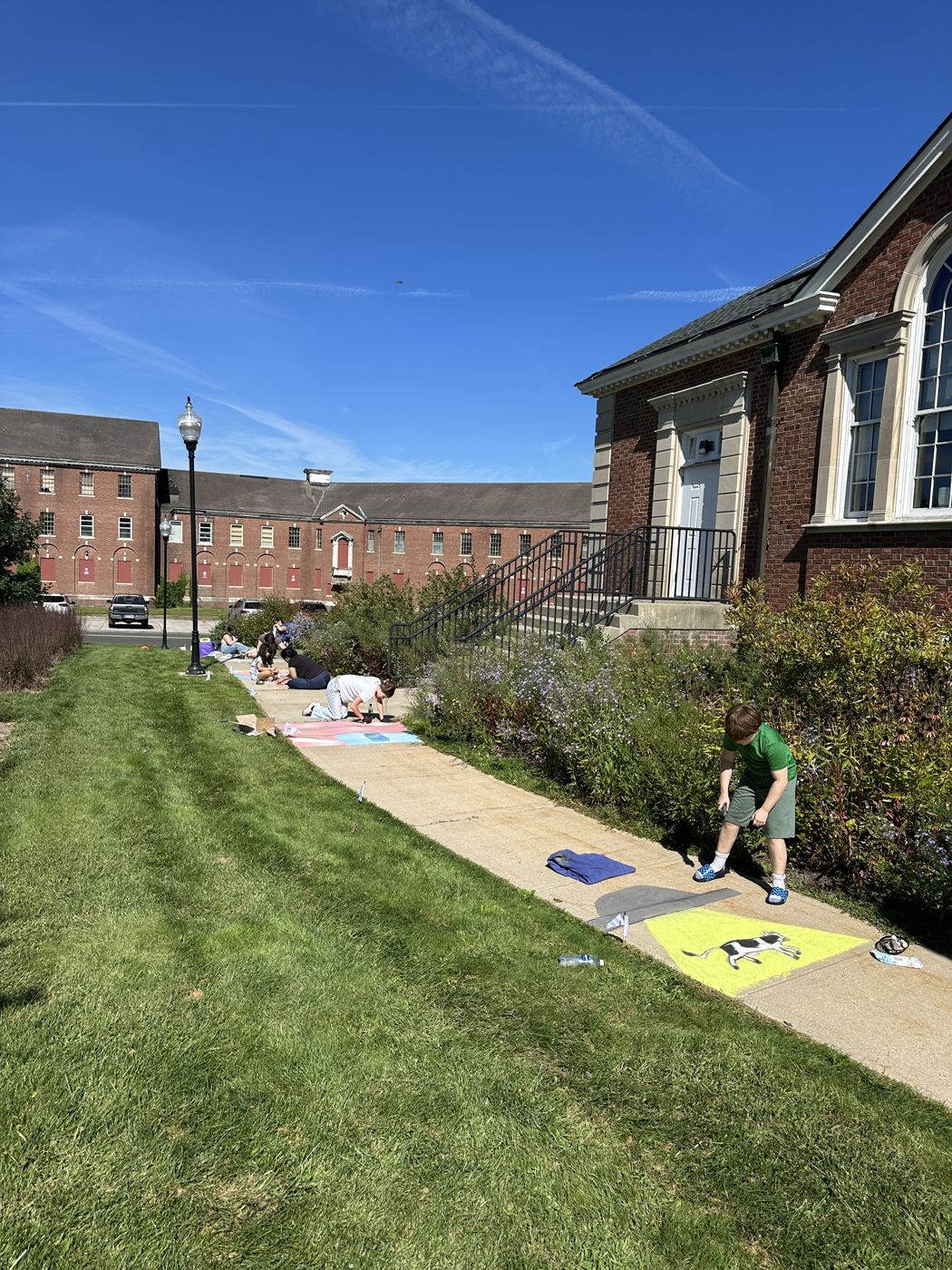 The Fairfield Hills campus lawn and sidewalk with chalk squares